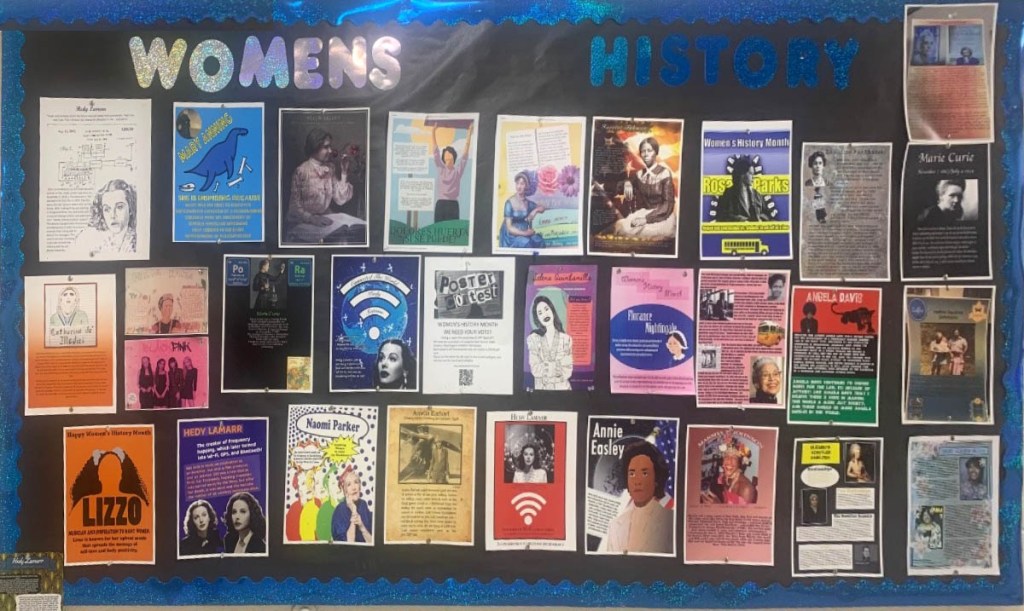 a display of all the posters printed out and hung on a bulletin board.