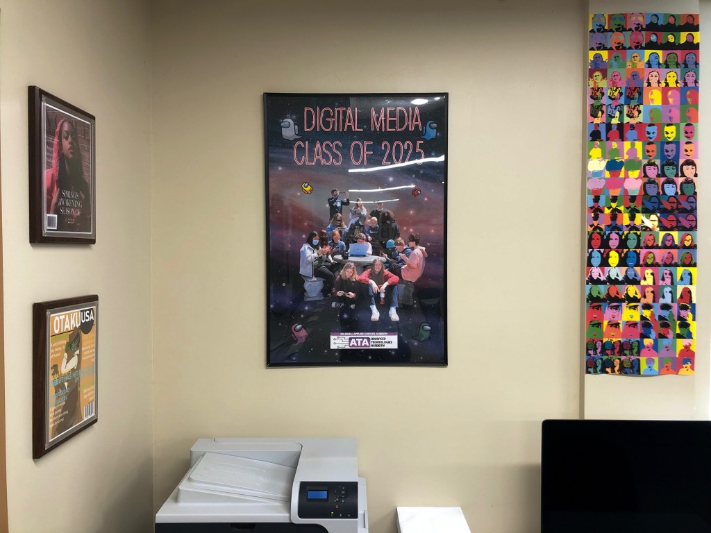 a photo of the class of 2025 poster hanging on the classroom wall