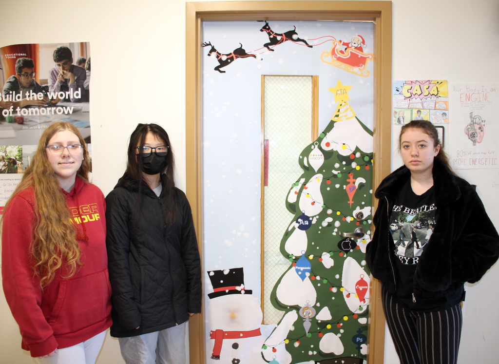 Aubree, Dahlie, and McKenzie decorated Mrs. Pennell's classroom door. 